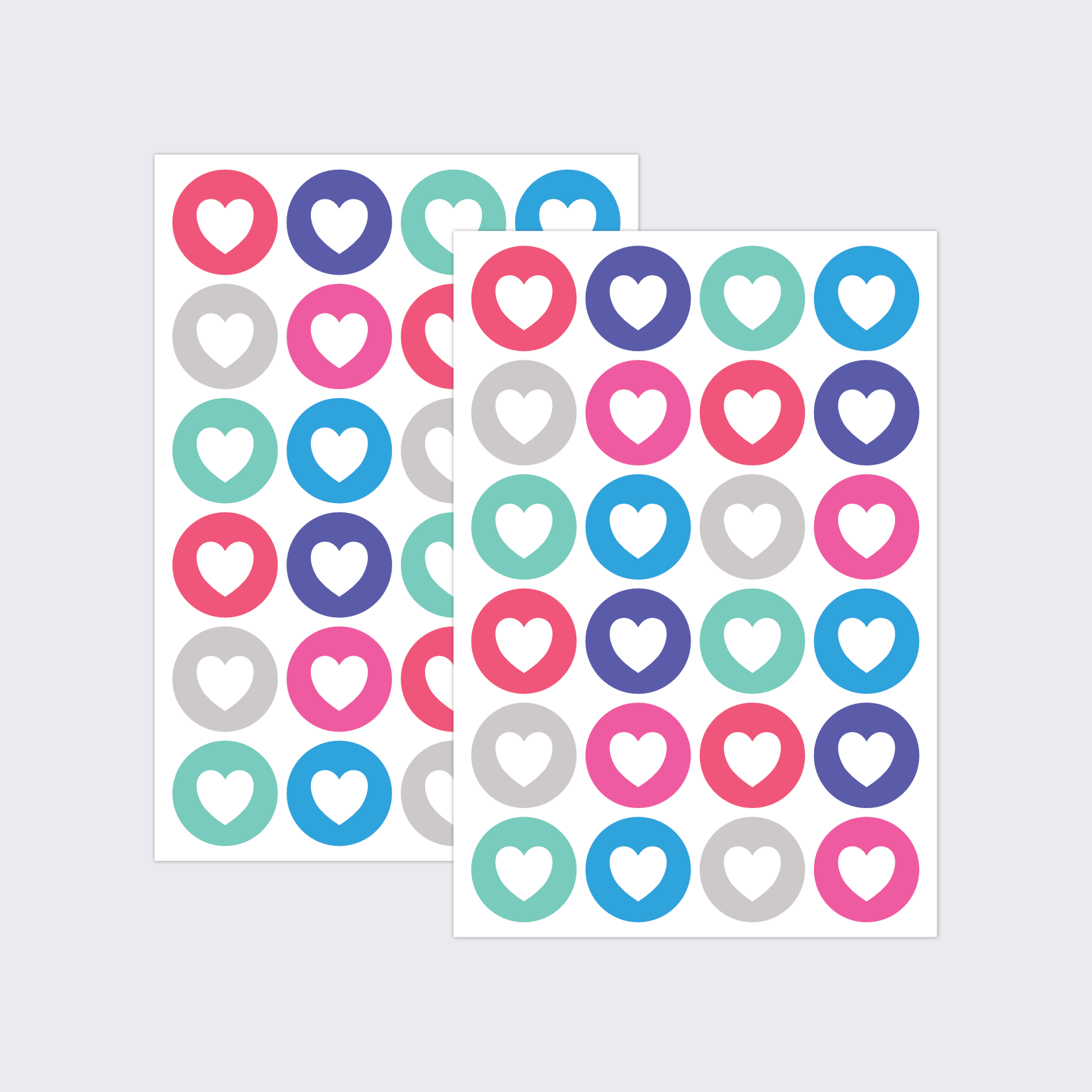 Two sheets of round stickers with a colourful heart-shaped design.